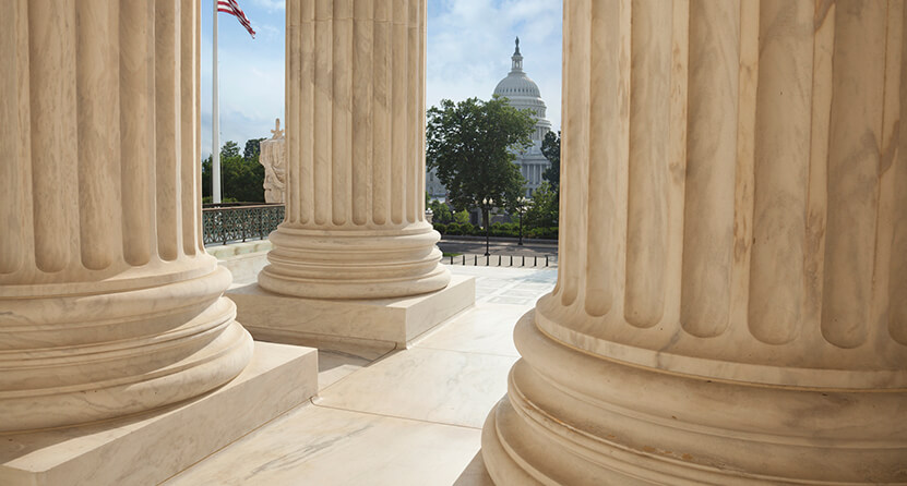 An Opus Interactive blog post image of a view of the Whitehouse with the view being concealed by pillars in front.
