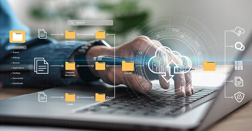 An Opus Interactive blog post image of a closeup of a man working on a laptop, with a cloud icon and files with folders overlayed on top.