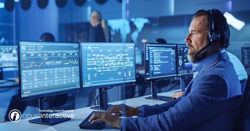 A blog image post that shows a man with a mic-headset working on a computer.