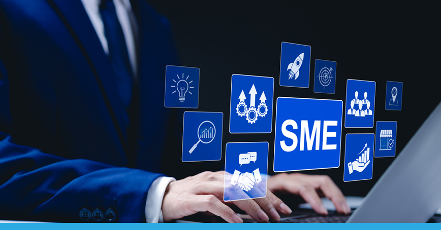 A Blog post image of a man at a laptop, there are icons over the image that feature settings icons and SME's.